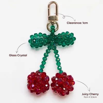 The cherry keychain, marked 11 × 5.5 cm, with a clasp that opens 1 cm