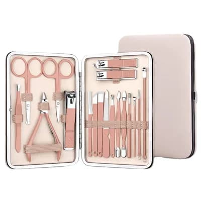 The open kit in its plain blush case: rose-gold scissors, clippers, nippers, tweezers and fine tools