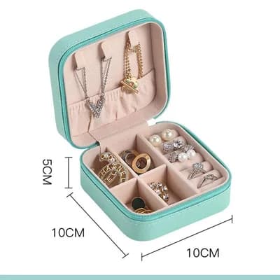 An open mint mini jewelry box holding jewelry, marked 10 cm wide, 10 cm deep and 5 cm tall