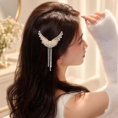 The clip seen from the side, in long dark hair