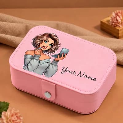 A pink jewelry box printed with a girl in a gray sweater putting on lipstick in a compact mirror, with “Your Name” beside her