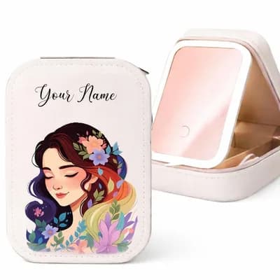 A white makeup case printed with a girl with flowers in her hair, with “Your Name” above her, beside the open case and its mirror