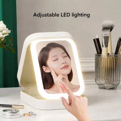 A woman’s face in the lit mirror as a finger touches the button that changes the light