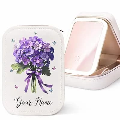 A white makeup case printed with a bouquet of purple flowers tied with a ribbon, with “Your Name” below, beside the open case