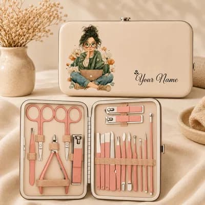 A cream case with “Your Name” beside an illustration of a girl in glasses sitting cross-legged with a laptop among flowers, next to the open kit of rose-gold tools