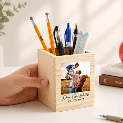 A hand holding the photo pen holder