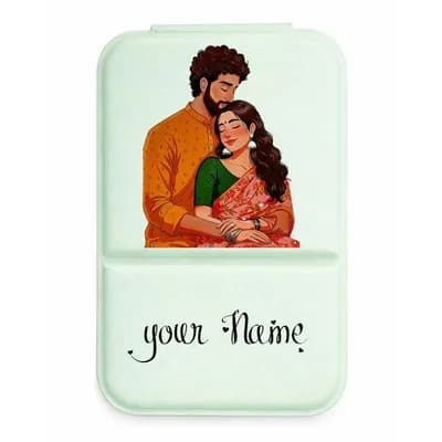A mint mirror cover printed with a couple in an embrace, she in a red saree, and a name below it