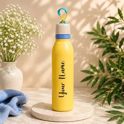 A pastel yellow water bottle with a cream cap and a blue band and loop, with “Your Name” printed along its side