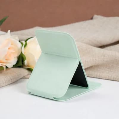 A mint mirror folded into its stand, seen from behind